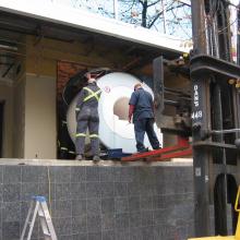 Moving in new MRI machine into medical building.