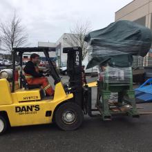 One of our 15,000lb Capacity Forklifts moving a piece of equipment 